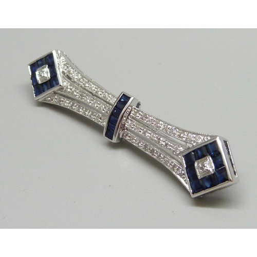 1021 - An 18ct white gold Art Deco brooch set with diamonds and sapphires, marked K18 .50, 8.9g, 5.8cm, box... 