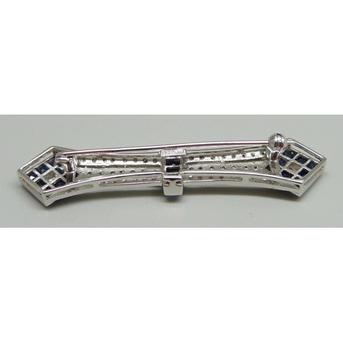 1021 - An 18ct white gold Art Deco brooch set with diamonds and sapphires, marked K18 .50, 8.9g, 5.8cm, box... 