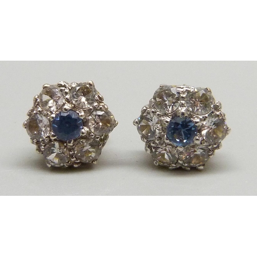 1022 - A pair of 9ct gold cluster earrings set with blue and white stones, 2.7g