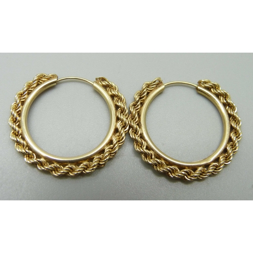 1034 - A pair of yellow metal rope design hoop earrings, 1.8g, 2.8cm across