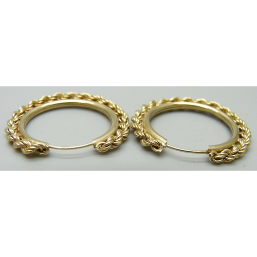 1034 - A pair of yellow metal rope design hoop earrings, 1.8g, 2.8cm across