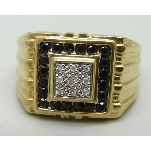 1049 - A gentleman's 9ct gold, diamond and sapphire ring, 5.8g, U