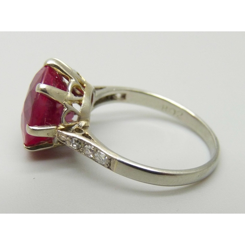 1059 - A white metal ring, set with a large synthetic ruby and diamond shoulders, 3.7g, M