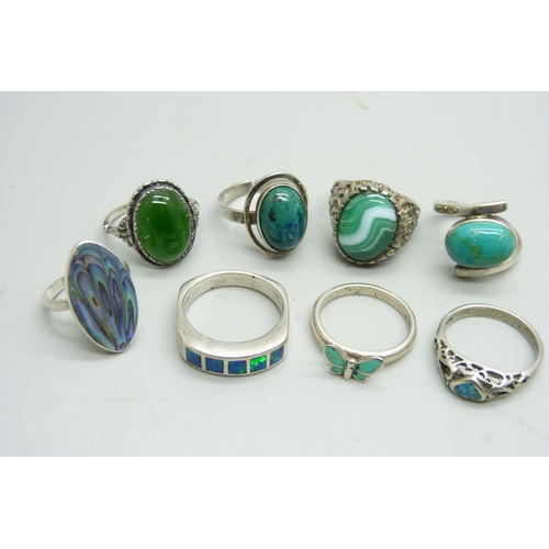 1074 - Eight silver stone set rings, 36g