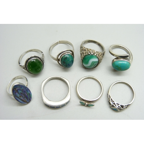 1074 - Eight silver stone set rings, 36g