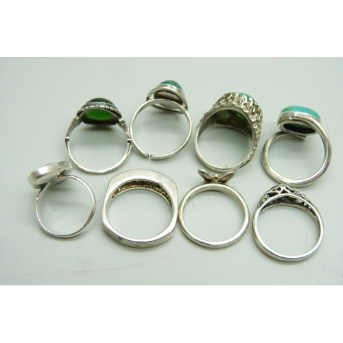 1074 - Eight silver stone set rings, 36g