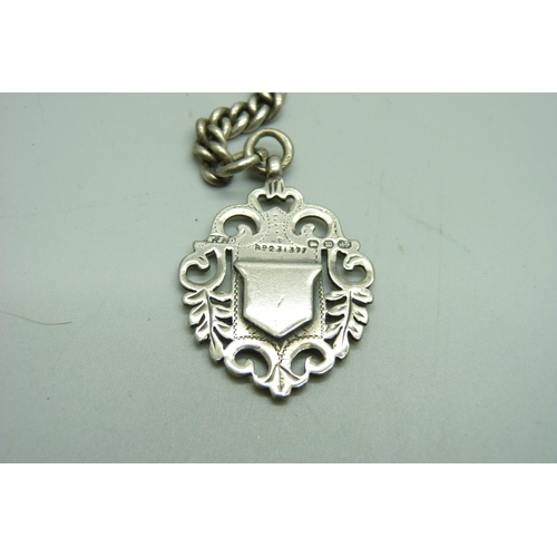 1075 - A silver double Albert chain and fob, 74g