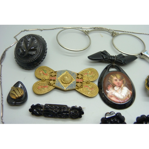 1098 - A pair of lorgnettes, a harp brooch, an enamelled watch case back, a belt buckle, etc.