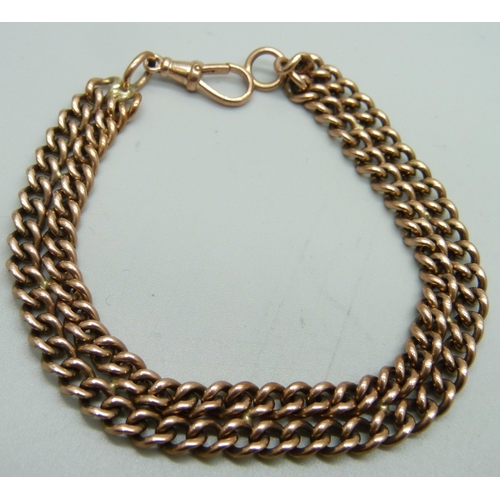 1155 - Two yellow metal chains combined to form a bracelet, dog clip marked as 9ct, chains unmarked, 33g