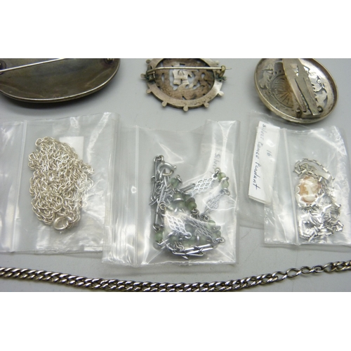 1164 - A collection of jewellery including two large silver brooches, a silver clip etc.