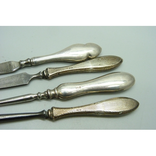 1165 - A silver manicure stand, Birmingham 1930, and silver handled tools