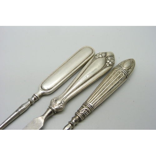 1167 - An Art Deco manicure stand, Birmingham 1935 and seven tools, six have silver handles