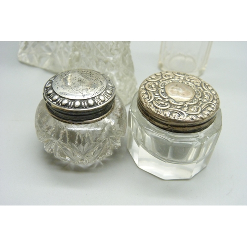 1168 - Silver topped jars, two scent bottles with silver collars, one stopper a/f, one bottle lid a/f