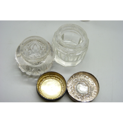 1168 - Silver topped jars, two scent bottles with silver collars, one stopper a/f, one bottle lid a/f