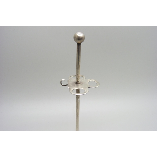 1171 - A silver manicure stand, Chester 1911 and three silver handled tools