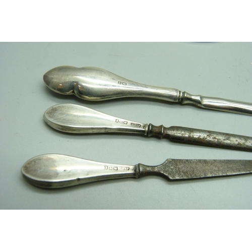 1171 - A silver manicure stand, Chester 1911 and three silver handled tools