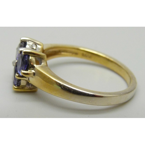 1180 - A silver gilt and tanzanite ring, O