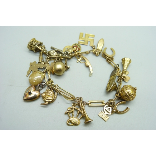 1195 - A 9ct gold charm bracelet, 31.8g gross