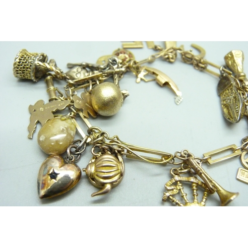 1195 - A 9ct gold charm bracelet, 31.8g gross