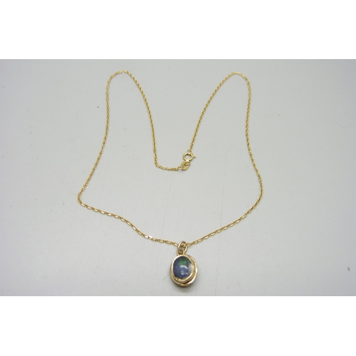 1199 - An 18ct gold pendant, set with black opal and chain, 4.3g