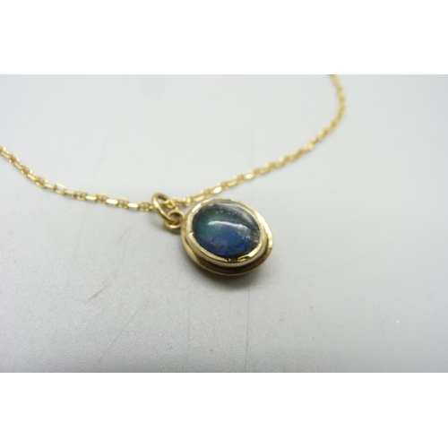 1199 - An 18ct gold pendant, set with black opal and chain, 4.3g