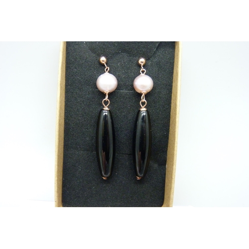 1203 - A pair of silver gilt, onyx and pearl drop earrings