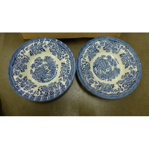 1234 - A 1982 blue Tonquin dinner set comprising six dinner plates, six soup plates, six side plates, six c... 