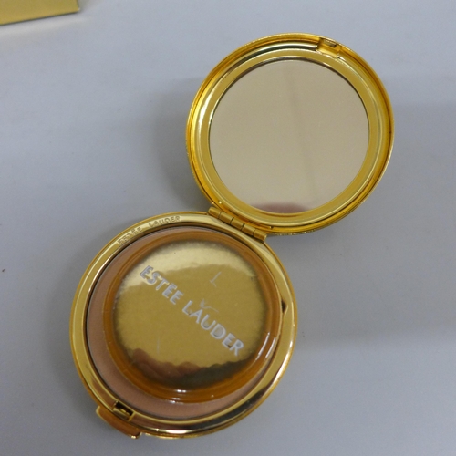 644 - An Estee Lauder Golden Millennium compact, boxed