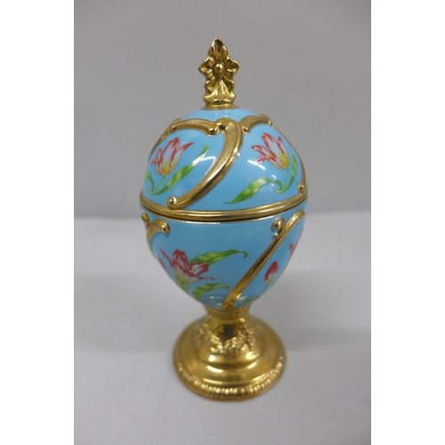 647 - A Murano style glass paperweight and a House of Faberge Tulip egg