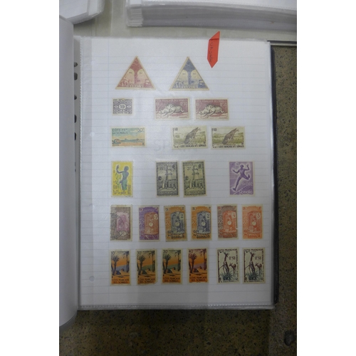 653 - Two folders of worldwide stamps, including British Commonwealth