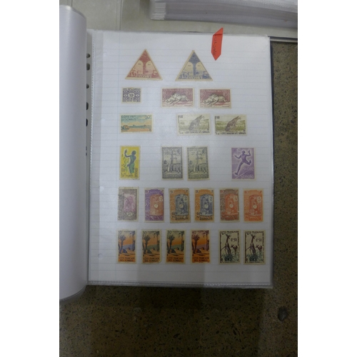 653 - Two folders of worldwide stamps, including British Commonwealth