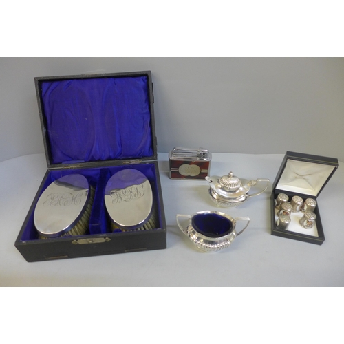 683 - A silver brush set, boxed, Colibri lighter, six Hummel thimbles and two plates condiments