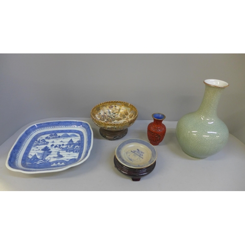 693 - A Japanese Satsuma bowl and wooden stand, chip to rim, Chinese pottery and a cinnabar vase