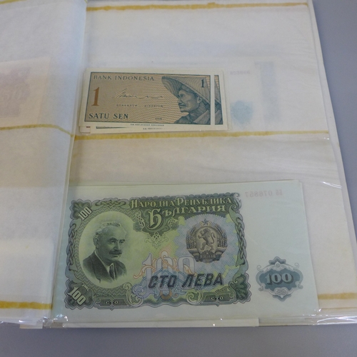 701 - Bank notes; duplicated stock of bank notes, including Chinese in album