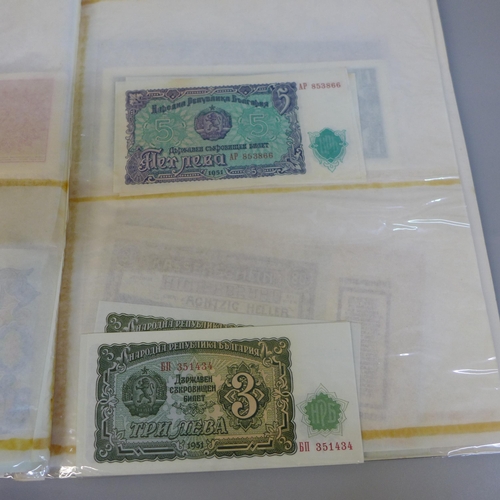 701 - Bank notes; duplicated stock of bank notes, including Chinese in album