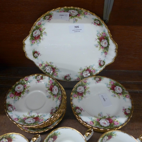 705 - A Royal Albert celebration six setting tea set lacking one cup, with sugar and milk jug