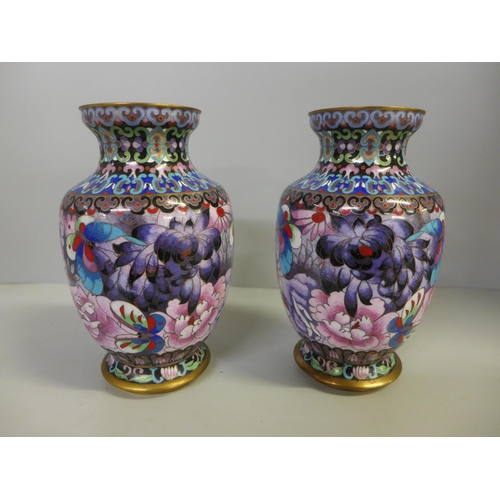 715 - A pair of Chinese cloisonne vases, decorated with flowers and butterflies, 18cm