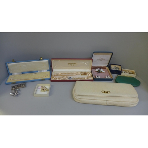 736 - A collection of costume jewellery, faux pearls and a clutch bag