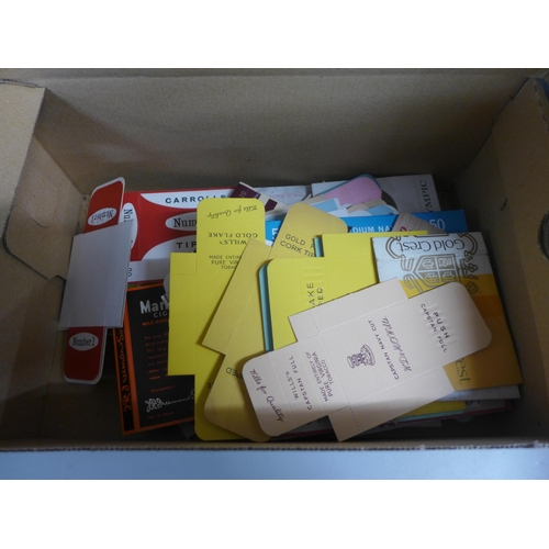 756 - A box of cigarette packets and an album of cigarette packets