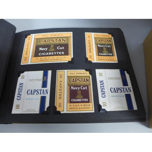 756 - A box of cigarette packets and an album of cigarette packets