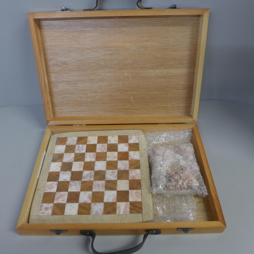 765 - A marble and onyx chess set with board in box