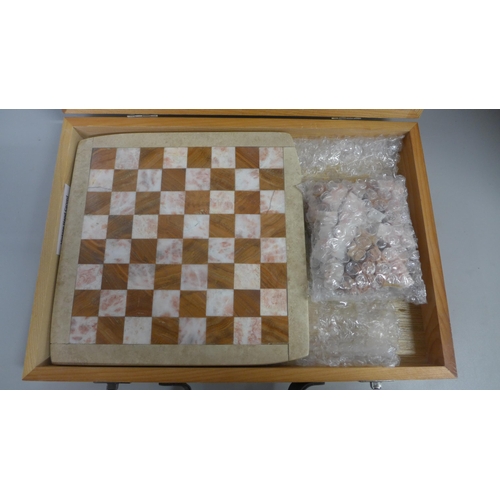 765 - A marble and onyx chess set with board in box