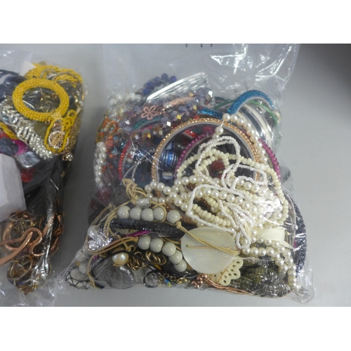 775 - Two bags of costume jewellery; bangles and necklaces