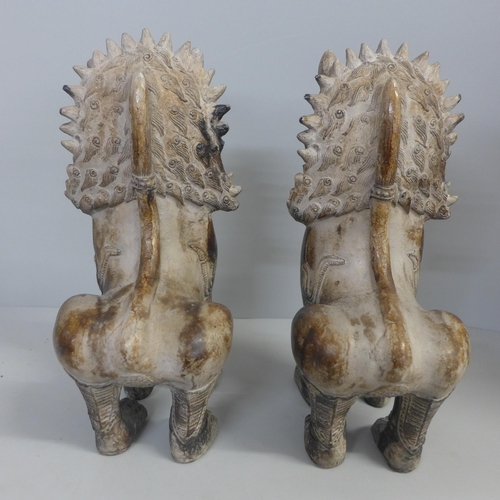 794 - A pair of stone dogs of fo, one a/f