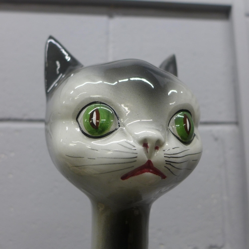 800 - A tall long neck cat figure