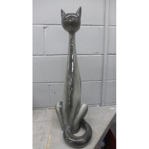 800 - A tall long neck cat figure