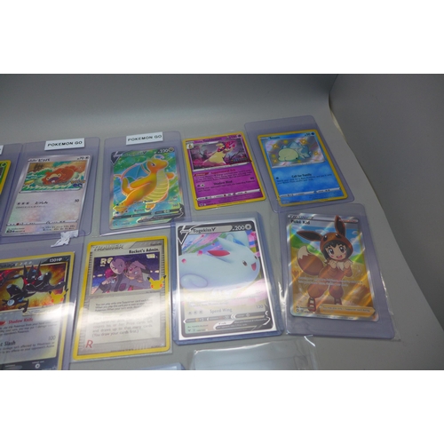 840 - Sixteen Pokemon cards including Japanese Charizard, promo, new, V-Cards, 1st Edition Magmar, etc.