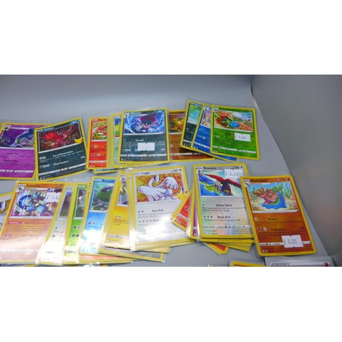 850 - 100 Holo and reverse holo Pokemon cards