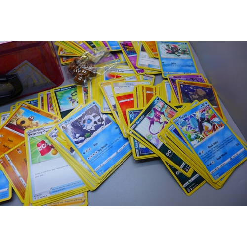 853 - Over 300 Pokemon cards with Celebrations collectors tin including holos and vintage cards