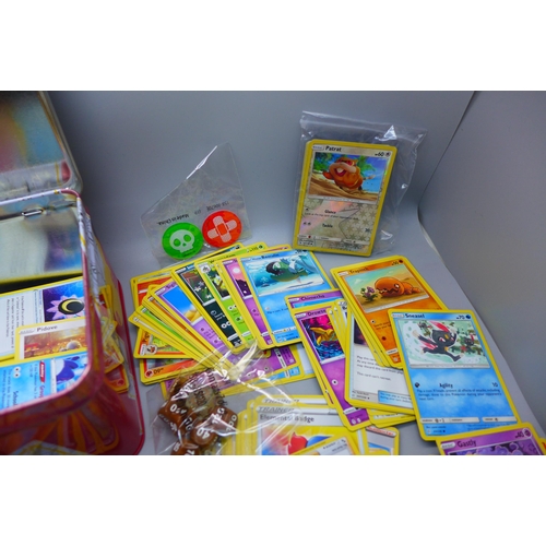 853 - Over 300 Pokemon cards with Celebrations collectors tin including holos and vintage cards